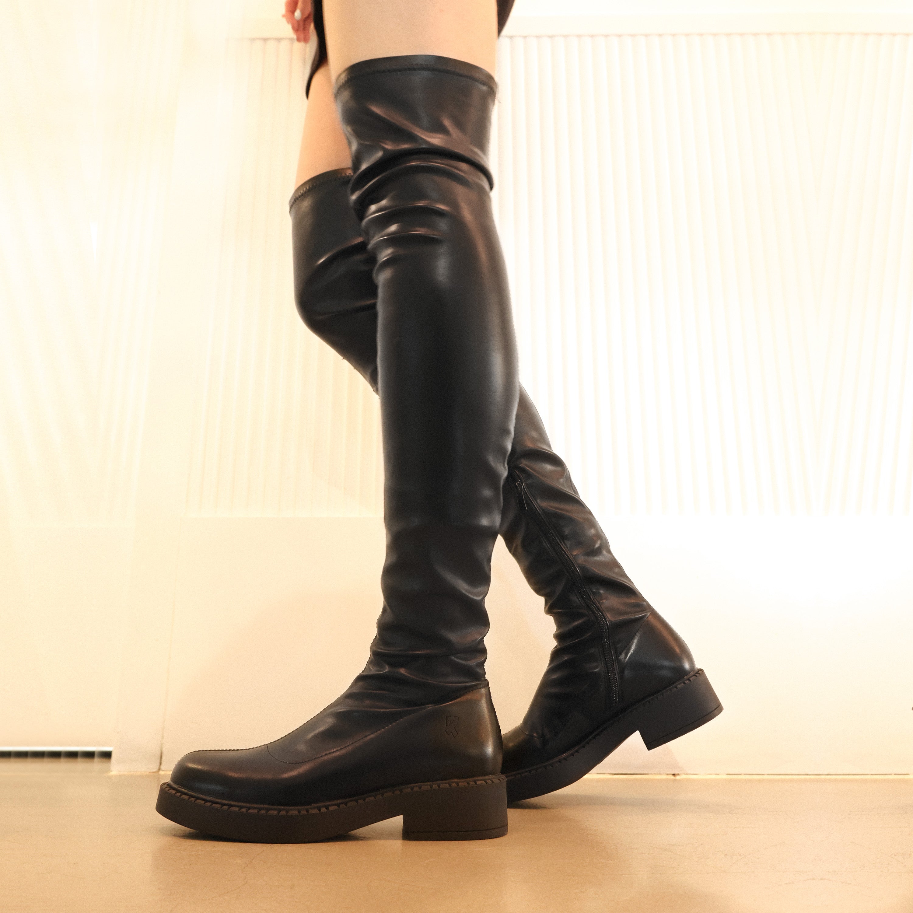 Flat brown hotsell thigh high boots